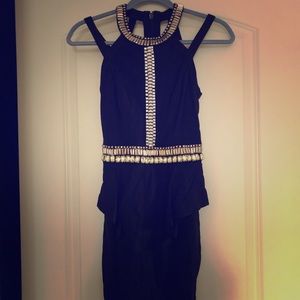 Fitted black Bebe size 0 peplum rhinestone dress
